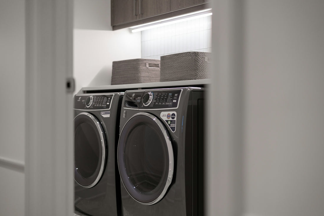 Modern laundry room with matching washer and dryer