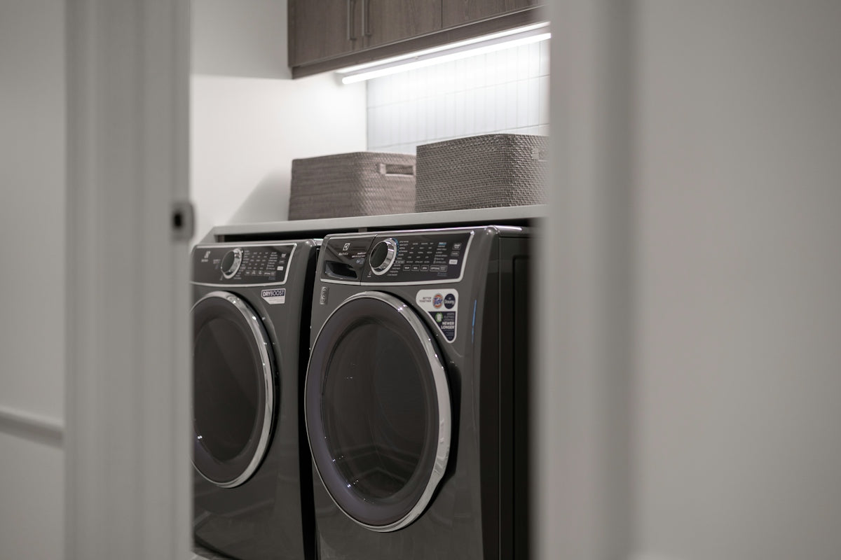 Modern laundry room with matching washer and dryer