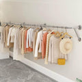 Wall-Mounted Stainless Steel Clothing Rack, Creative Boutique Coat Hanger by Unknown